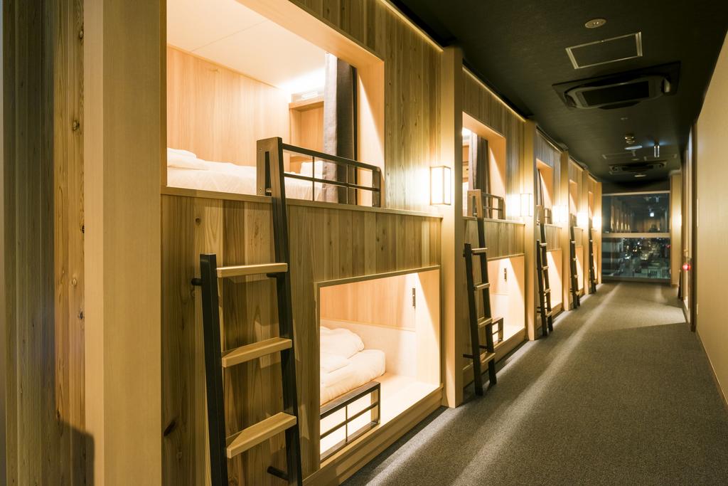 Row of pod openings along a panelled interior wall