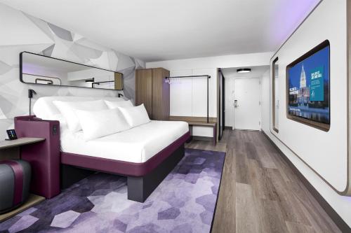 Compact room with a fold-away bed and a wide window